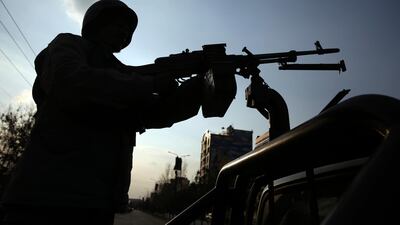 Afghan soldiers stand guard after an attack in Kabul on March 6, 2020. At least 24 security personnel were killed in an insider attack in Zabul province on March 20, 2020. AP Photo