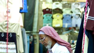 The elderly population in Saudi Arabia is likely to balloon to 15 per cent of the country by 2050 compared to 3 per cent now, which could lead to a rating downgrade. Above, a trader in Riyadh. Bilal Qabalan / AFP