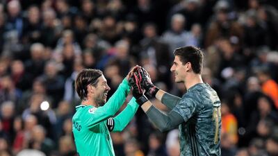 Real Madrid goalkeeper Thibaut Courtois celebrates with Sergio Ramos. EPA