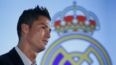 Cristiano Ronaldo signs a deal that ties him to Real Madrid until 2018. Gonzalo Arroyo Moreno / Getty Images