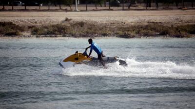 September 14, 2013 (Abu Dhabi) Jet skiers enjoy the water craft near the Shangri-La hotel in Abu Dhabi September 14, 2013. (Sammy Dallal / The National) (Vesla) *** Local Caption *** sd-091413-jetski-08.jpg