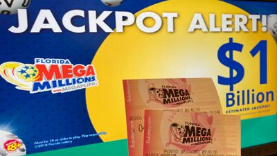 A giant Mega Millions lottery jackpot ballooned to $1.02 billion after no one matched all six numbers to win the top prize. AP