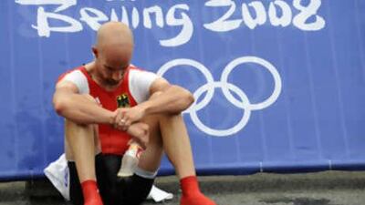 The German cyclist Stefan Schumacher looks on after placing only 13th of the men's road cycling individual time trial event during the 2008 Beijing Olympic Games, near the Great Wall in Juyongguan, 78 km north of Beijing. Schumacher tested positive during the Tour for the new blood-boosting drug CERA.