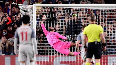 Liverpool goalkeeper Alisson fails to stop Barcelona's Lionel Messi's shot on goal, giving Barcelona a 3-0 lead. Manu Fernandez / AP Photo