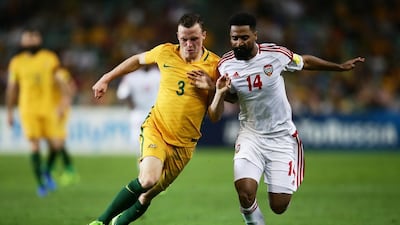 Australia's Brad Smith competes for the ball against the UAE's Abdulaziz Sanqour in Sydney. Matt King / Getty Images