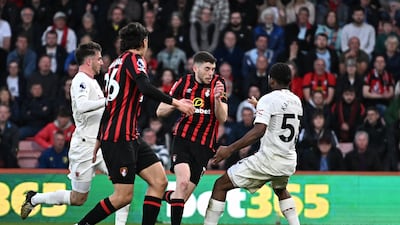Manchester United's Willy Kambwala fouls AFC Bournemouth's Ryan Christie to concede a penalty that was later ruled a free kick by VAR. Reuters
