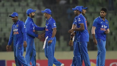 India players congratulate each other after beating Bangladesh in Dhaka. Munir uz Zaman / AFP / June 24, 2015