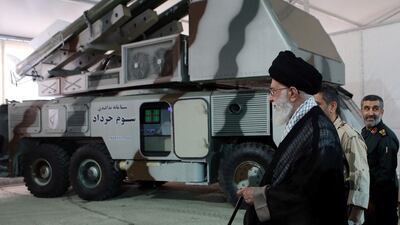 Iran's Supreme Leader Ayatollah Ali Khamenei, seen near a 3 Khordad system, reportedly used to shoot down a US military drone in the Strait of Hormuz / Fars news agency via Reuters
