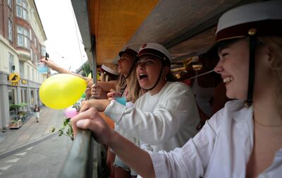 Danish students celebrate "Studenterkorsel", an event to mark the finishing of high school, as they travel on an open-backed truck through the city, stopping along the route to visit their parents' houses to drink and eat snacks, in Copenhagen, Denmark, June 25. Reuters