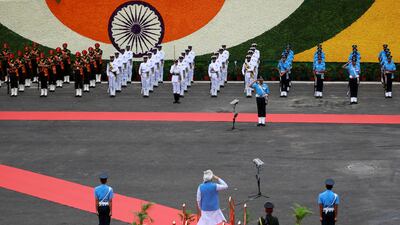 The prime minister salutes the honour guard. Reuters