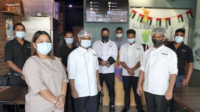 The team from Vasai Local restaurant in Dubai who are one of 18 restaurants providing hundreds of free meals each week as part of the Meals of Grace campaign. Pawan Singh / The National
