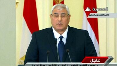 Egypt's interim president, Adly Mansour, on Saturday announces January 14-15 as the dates citizens will vote on new constitution. Egyptian TV / AFP