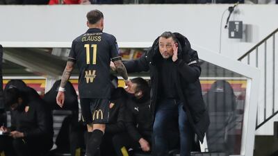 Lens' Jonathan Clauss and coach Franck Haise. Reuters