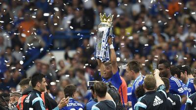 Chelsea's Didier Drogba celebrates with the Premier League trophy on Sunday. Tony O'Brien / Action Images / Reuters