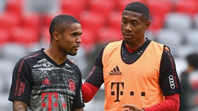 Bayern Munich's Brazilian midfielder Douglas Costa and Austrian defender David Alaba, right. AFP
