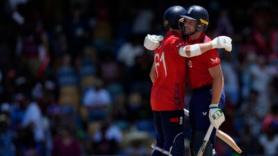 England captain Jos Buttler, right, and batting partner Phil Salt, who made 25, celebrate after their win. AP