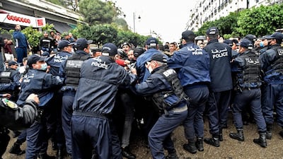 Algerian policemen block protesters from advancing during a demonstration in the capital Algiers, marking the second anniversary of the country’s anti-government Hirak protest movement. AFP