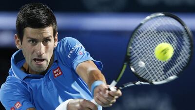 Novak Djokovic shown in action during his first round match against Vasek Pospisil on Tuesday at the Dubai Duty Free Tennis Championships. Ali Haider / EPA