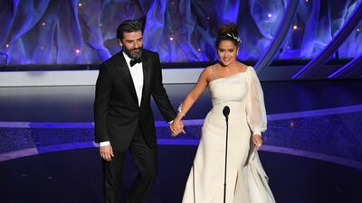 Oscar Isaac and Salma Hayek Pinault walk onstage during the 92nd Annual Academy Awards at Dolby Theatre. AFP