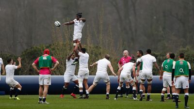 England flanker Maro Itoje jumps for the ball as the team practice a line-out during a training session at Pennyhill Park in Bagshot, west of London on March 16, 2017. Adrian Dennis / AFP