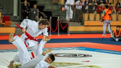 Abu Dhabi, March 4, 2018. Mix Under 21. Marion Decrap from Belgium gets tossed by her partner Ryan Lodens during a match against Italy. Victor Besa / The National Sports