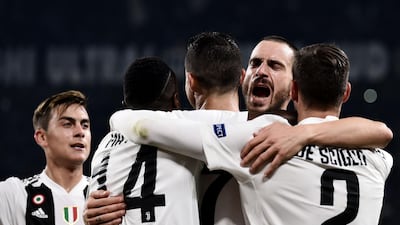 Juventus players congratulate Cristiano Ronaldo after the Portugguese striker gave the Italians a 1-0 lead. AFP