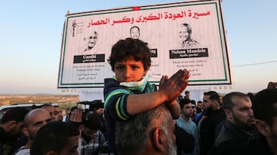 Palestinians protests on the Israel-Gaza border east of Gaza City. AFP/MAHMUD HAMS