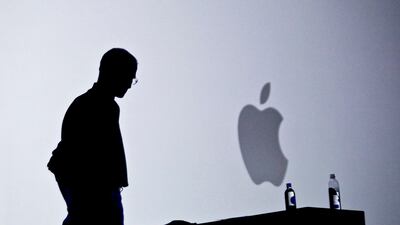 File - This June 7, 2010 file photo shows Apple chief executive Steve Jobs introducing the iPhone 4 during the keynote address at the Apple Worldwide Developers Conference in San Francisco, California. Apple on Wednesday, October 5, 2011 announced the dea???