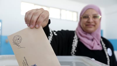 A Lebanese woman casts her ballot during the municipal elections at a polling station in the southern port city of Sidon. EPA