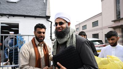 Aihtsham Rashid greets Iman Mufti Abdur Rahman Mangera at the opening of the first mosque built on the Western Isles, Stornoway, Scotland, on May 11, 2018. Jeff J Mitchell / Getty Images