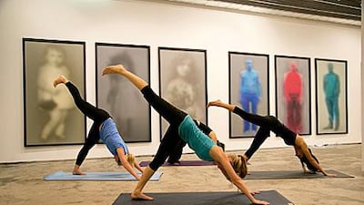 Arty manoeuvres: sessions three times a week at the XVA Gallery in DIFC combine the regular relaxing effects of yoga with the introspective influence of being surrounded by art. Courtesy of Urban Yoga