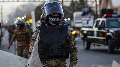 Riot police try to disperse demonstrators during anti-government protests in Basra, Iraq. AP Photo