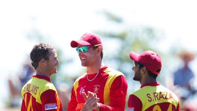 Sean Williams, Craig Ervine and Sikandar Raza celebrate the fall of a UAE wicket at the 2015 World Cup. Getty Images