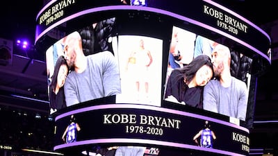Players and fans stand to honor Kobe Bryant before an NBA game between the Chicago Bulls and the San Antonio Spurs on Monday, January 27. AP