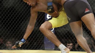 Daniel Cormier, right, takes down Anderson Silva during their light heavyweight bout at UFC 200, Saturday, July 9, 2016, in Las Vegas. John Locher / AP Photo