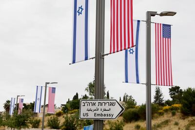 A road sign and flags are placed at the road leading to the US consulate in the Jewish neighborhood of Arnona on the East-West Jerusalem line. EPA
