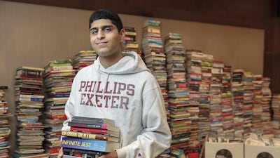 Ali Hassani, 17, the UAE Ambassador for the World Literature Foundation with the some of the several thousand books he has collected to donate to the Al Arqam School in Al Barsha. Antonie Robertson/ The National