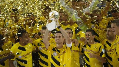 Borussia Dortmund celebrating with the German Super Cup trophy after their victory over Bayern Munich in Dortmund on August 13, 2014. Ina Fassbender / Reuters