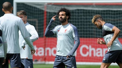 Liverpool's Mohamed Salah, center, takes part in a training session ahead of their Champions League Final. AP Photo