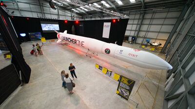 People look at the Virgin Orbit Launcher One rocket on the opening day of the Story of a Satellite summer exhibition at Spaceport Cornwall last August in Newquay, England. Getty Images)