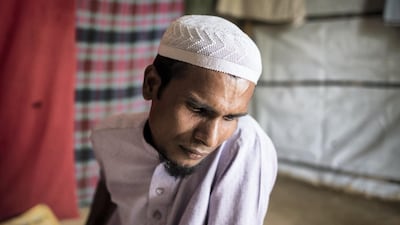 Jahid Hussein, 33, cries at Kutupalong refugee camp near Cox's Bazar as he recounts how eight members of his immediate family were killed by the Myanmar military. Campbell MacDiarmid for The National