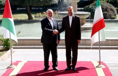 Iranian Foreign Minister Hossein Amirabdollahian, right, meets Hamas leader Ismail Haniyeh in Tehran. EPA