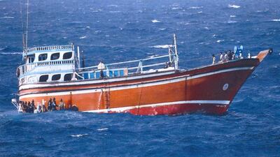 Members of the coalition naval force board the ship that was loaded with five tonnes of hashish. All 14 men aboard were arrested. Courtesy Dubai Police