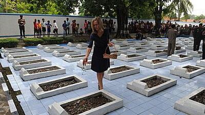 The human-rights lawyer Liesbeth Zegveld sprinkles flowers on the graves of victims of the Rawagede massacre West Java province last month after the Dutch government offered a formal apology to Indonesia for the 1947 incident.