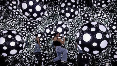 Kusama’s signature polka dots and reflective mirrors in Hong Kong. AFP