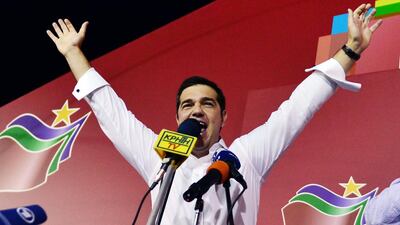 Syriza leader Alexis Tsipras celebrates his party's victory in the Greek general elections. (Louise Couliamaki / AFP)