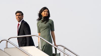UK Prime Minister Rishi Sunak and his wife Akshata Murty board a plane in Tokyo on their way to Hiroshima. AFP
