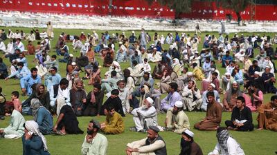 Afghan boys receive free rations distributed by the provincial government during the Muslim holy month of Ramadan amid a lockdown due to the ongoing coronavirus and COVID-19 pandemic, in Jalalabad, Afghanistan. EPA