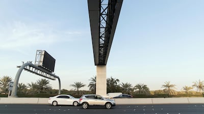 Since April 15, new toll gates installed on roads across Abu Dhabi have been scanning cars that pass beneath to check whether they are registered. Reem Mohammed/ The National