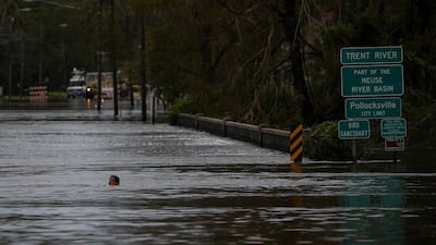 A man swims in a flooded street after the passage of Hurricane Florence in New Bern, North Carolina. Reuters